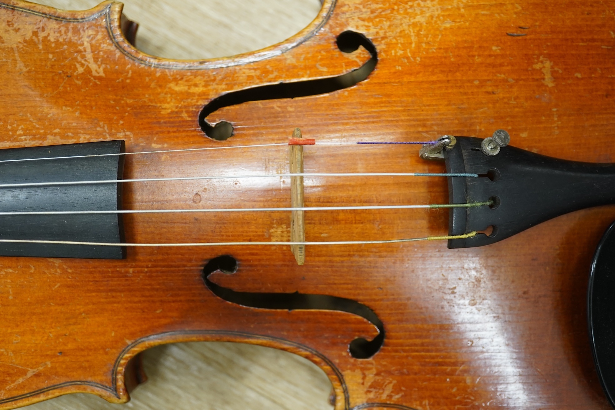 Two cased three quarter size violins, one labelled the London violin Co Ltd, length of back 33.5cm. Condition - both scratched